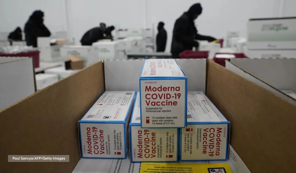 branded stacked boxes of Moderna COVID-19 vaccines being ready for shipment